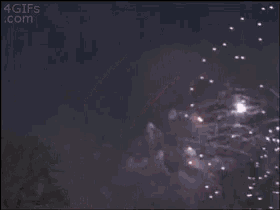 fireworks are displayed in the night sky with the website 4gifs.com in the corner