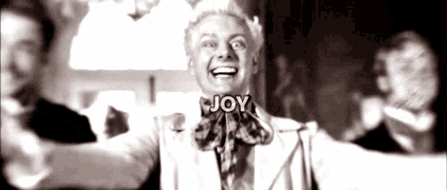 a black and white photo of a man with the word joy written on his face