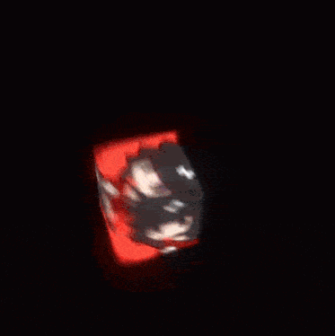 a blurred image of a person 's face in a red room