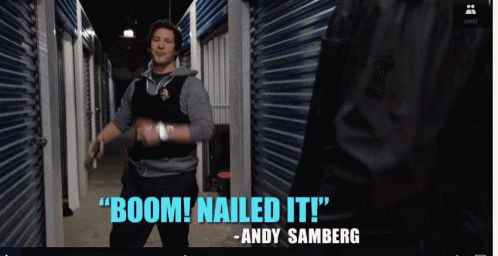 a man standing in a hallway with the words boom nailed it