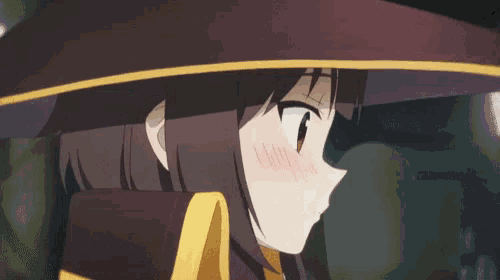 a close up of a girl 's face with a hat on