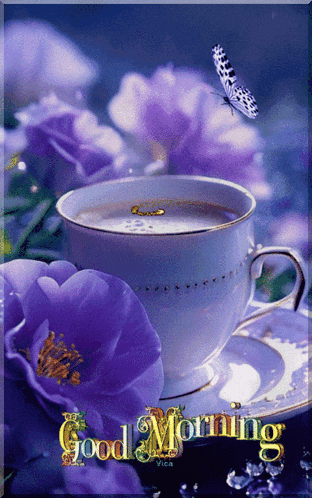 a cup of coffee sits on a saucer with purple flowers and a butterfly flying over it