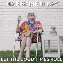 an elderly woman is sitting in a chair holding a glass of wine and saying happy birthday let the good times roll