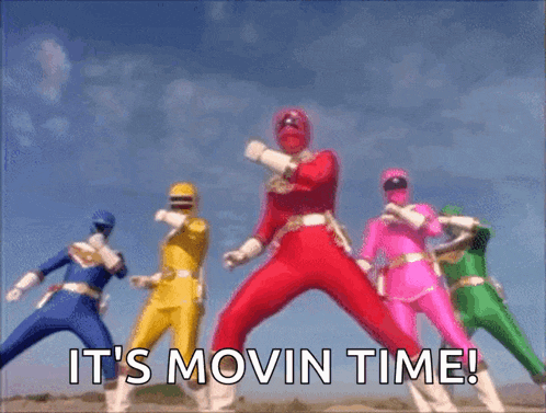 a group of power rangers are jumping in the air with the words it 's movin time behind them .