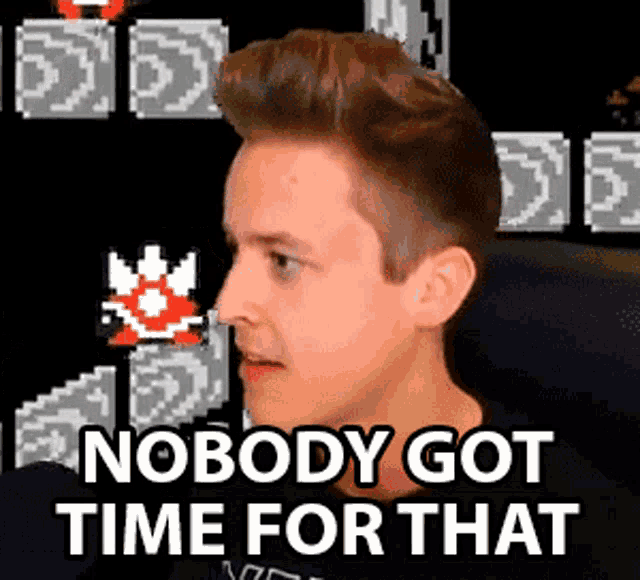 a man is sitting in front of a video game screen and says nobody got time for that