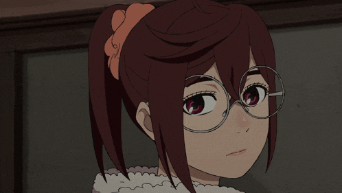 a close up of a girl wearing glasses