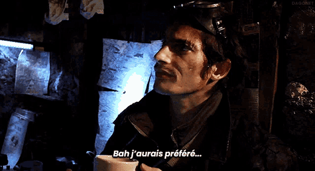 a man with a goggles on his head says bah j'aurais prefere