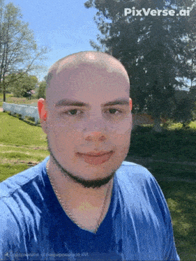 a man wearing a blue shirt is taking a selfie with pixverse.ai written on the bottom