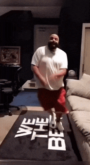 a man is jumping on a rug that says " we the best "