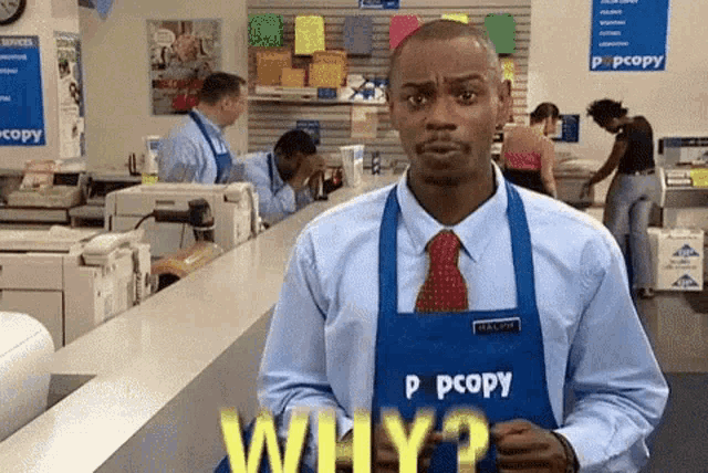 a man wearing an apron that says p copy is standing in a store