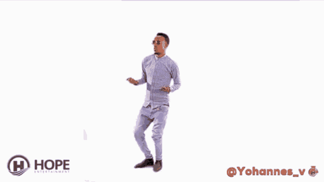 a young man in a striped shirt and purple jeans is dancing on a white background .