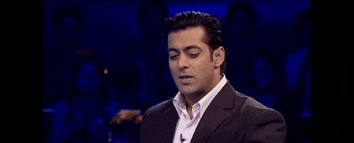 a man in a suit with the words kitne pratishat bharatiye written below him