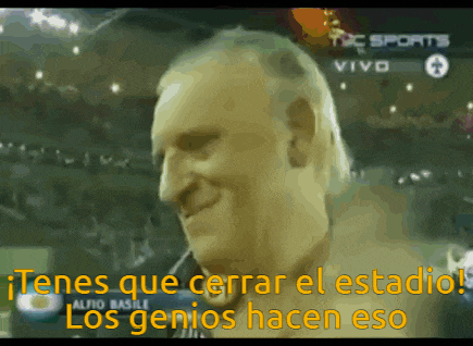 a man is smiling in front of a screen that says tc sports