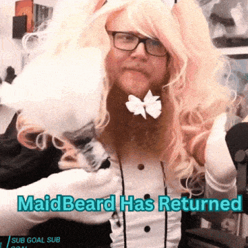 a man dressed as a maid with the words maidbeard has returned