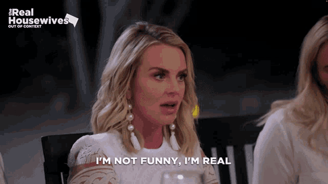 a woman says " i 'm not funny i 'm real " in front of a real housewives logo