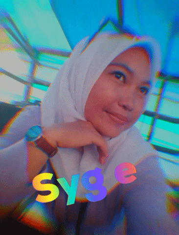 a woman wearing a hijab and a watch with sy9e written on the bottom right