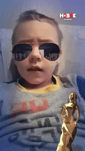 a boy wearing sunglasses and a shirt that says ' all star '