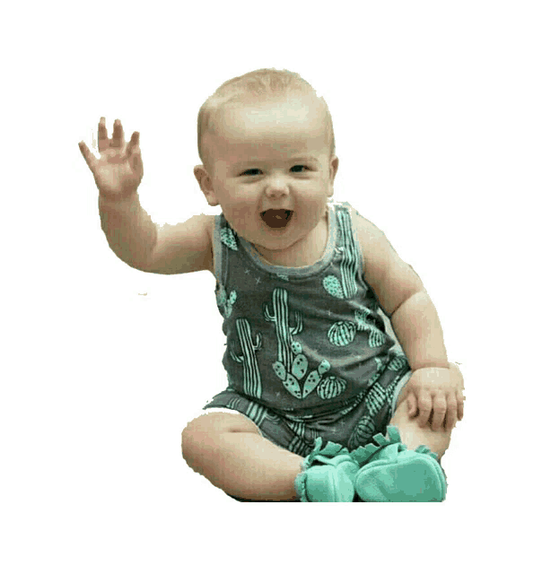 a baby wearing a tank top with cactus on it sits on the floor