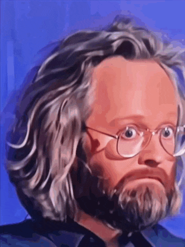 a man with glasses and a beard is wearing a blue shirt .