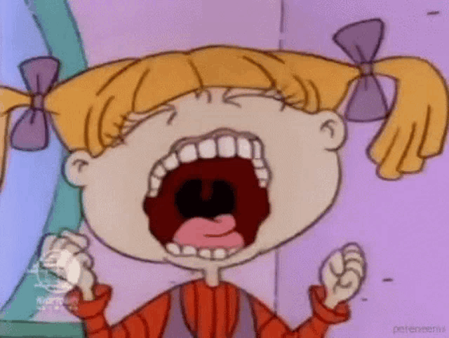 a girl from rugrats is crying with her mouth open and a fist in the air .