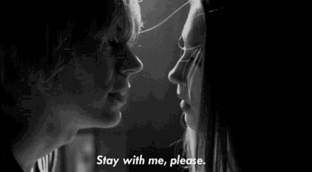 a black and white photo of a man and a woman looking at each other with the words stay with me , please .