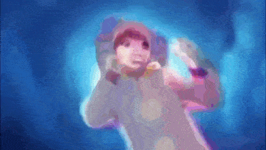 a blurred image of a person in a hooded jacket