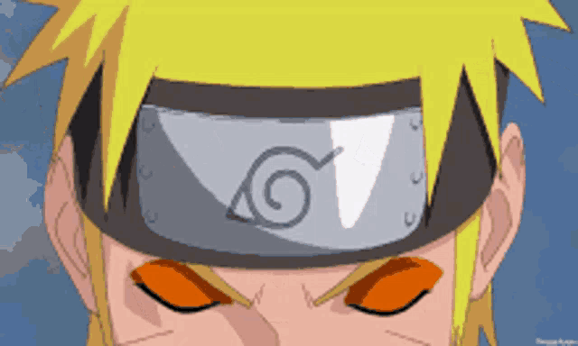 a close up of a person wearing a headband with a spiral on it