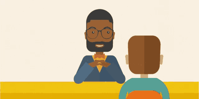 a man with glasses and a bow tie is sitting at a desk with another man
