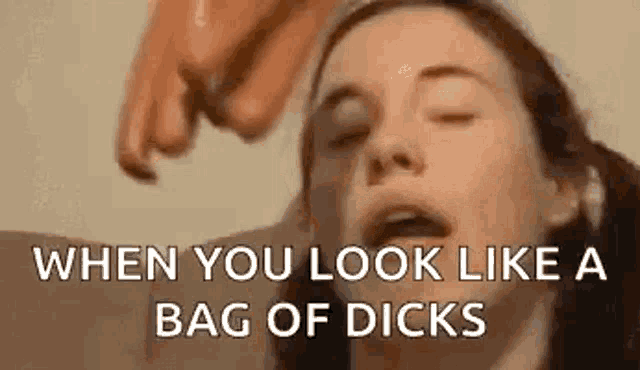 a woman with her eyes closed is getting a blowjob from a man 's hand .