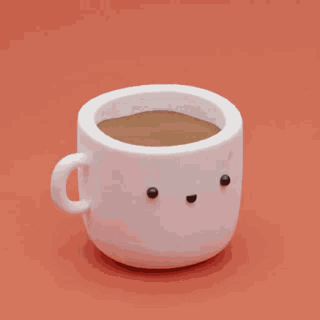 a close up of a marshmallow with a smiling face on a red background .