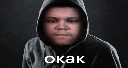 a man in a hooded sweatshirt with the word okak written on the bottom
