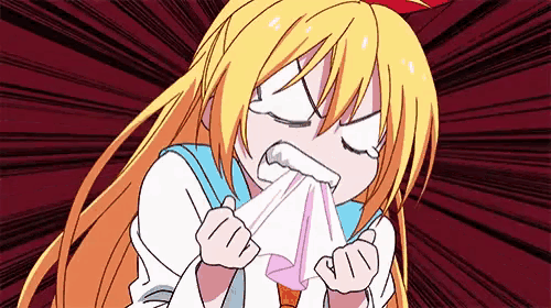 a cartoon girl with long blonde hair is blowing her nose with a napkin .