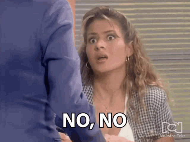 a woman with a surprised look on her face says no