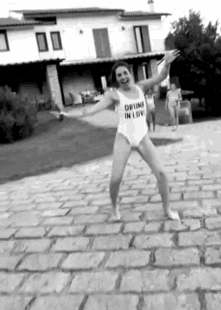 a woman in a swimsuit with the words drunk in love on it