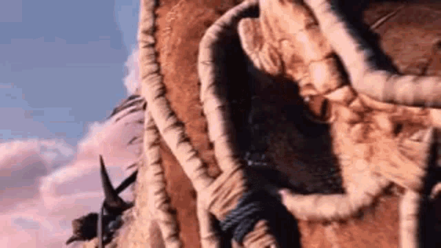 a close up of a rope hanging from a wall in a desert .