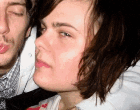 a close up of a woman 's face next to a man