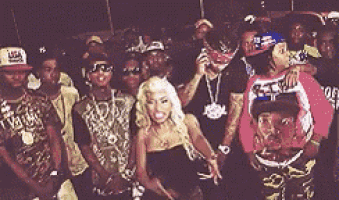 a group of people are posing for a picture and one of them is wearing a hat that says usa on it .