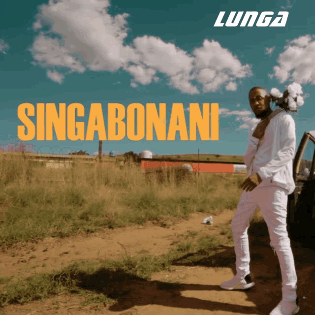 a man standing next to a car with singabonani written on the front