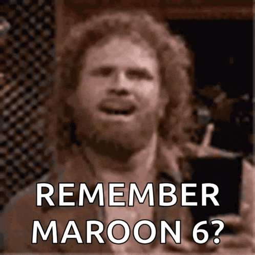 a man with a beard is singing remember maroon 6