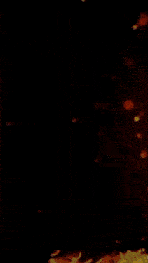a close up of a fire burning on a black background