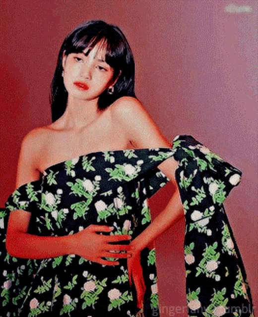 a woman in a floral off the shoulder dress with the word ginger on the bottom right