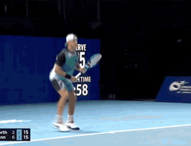 a tennis player with the number 5 on his shorts