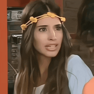 a woman wearing a headband with flowers on it