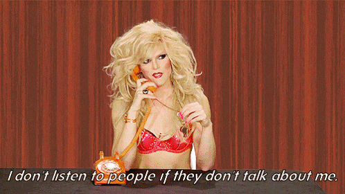 a blonde woman in a red bra is talking on an orange telephone with the words i don t listen to people