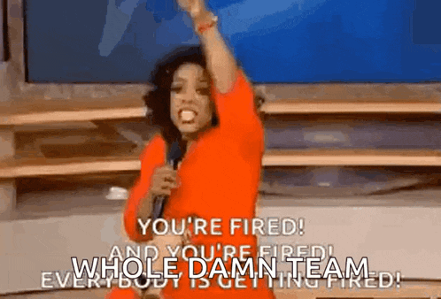 a woman in a red dress is holding a microphone and saying `` you 're fired ! ``