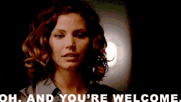 a woman says oh and you 're welcome in a dark room