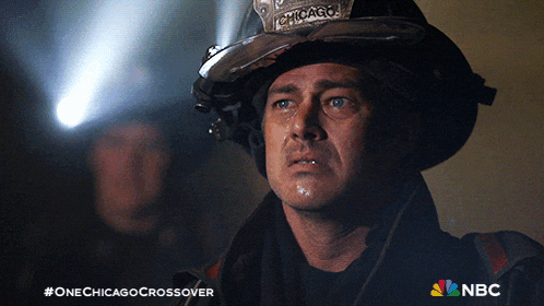 a man in a chicago helmet looks at something