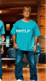 a man in a blue shirt that says mmtlp on it