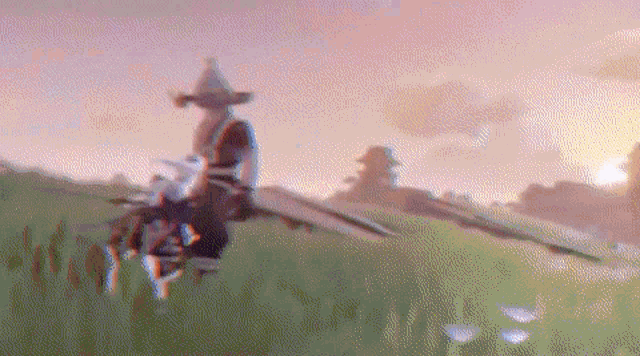 a blurry picture of a person standing in a field with a sword .