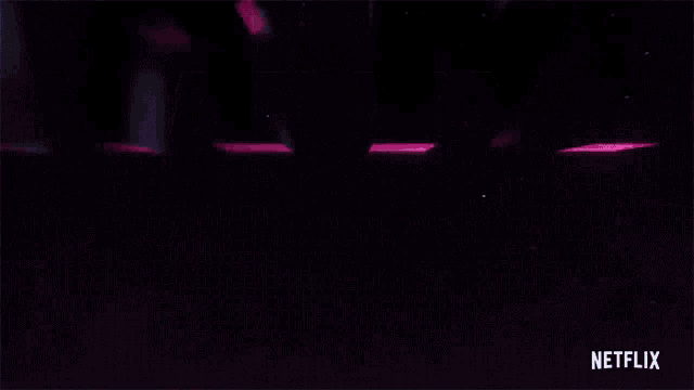a neon sign that says army of the dead with a netflix logo below it